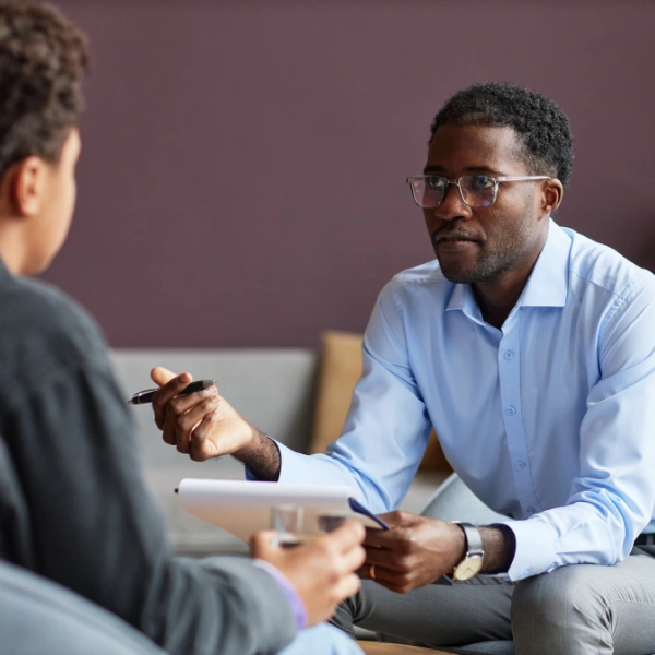 Image showing a homeowner asking questions about their roofing estimate.