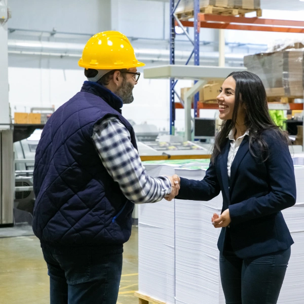 Image with a Staten Island customer and a roofer agreeing on a fall roof replacement.